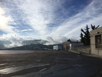 Scenic view of mountains against cloudy sky