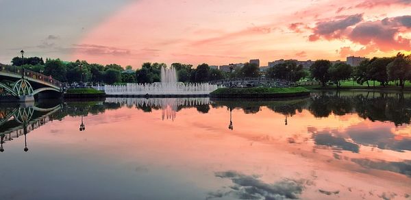 Scenic view of lake against orange sky