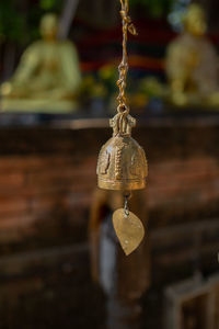 Close-up of bell hanging against temple