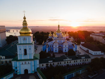 High angle view of buildings against sky at sunset