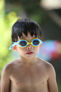 Portrait of boy wearing swimming goggles