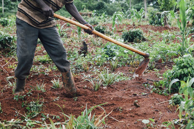 Low section of man standing on ground