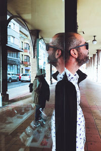 Digital composite image of man looking at camera