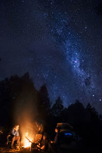 Camp life, campfire, sky full of stars