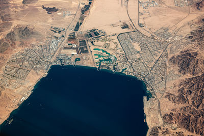 High angle view of airplane flying over land