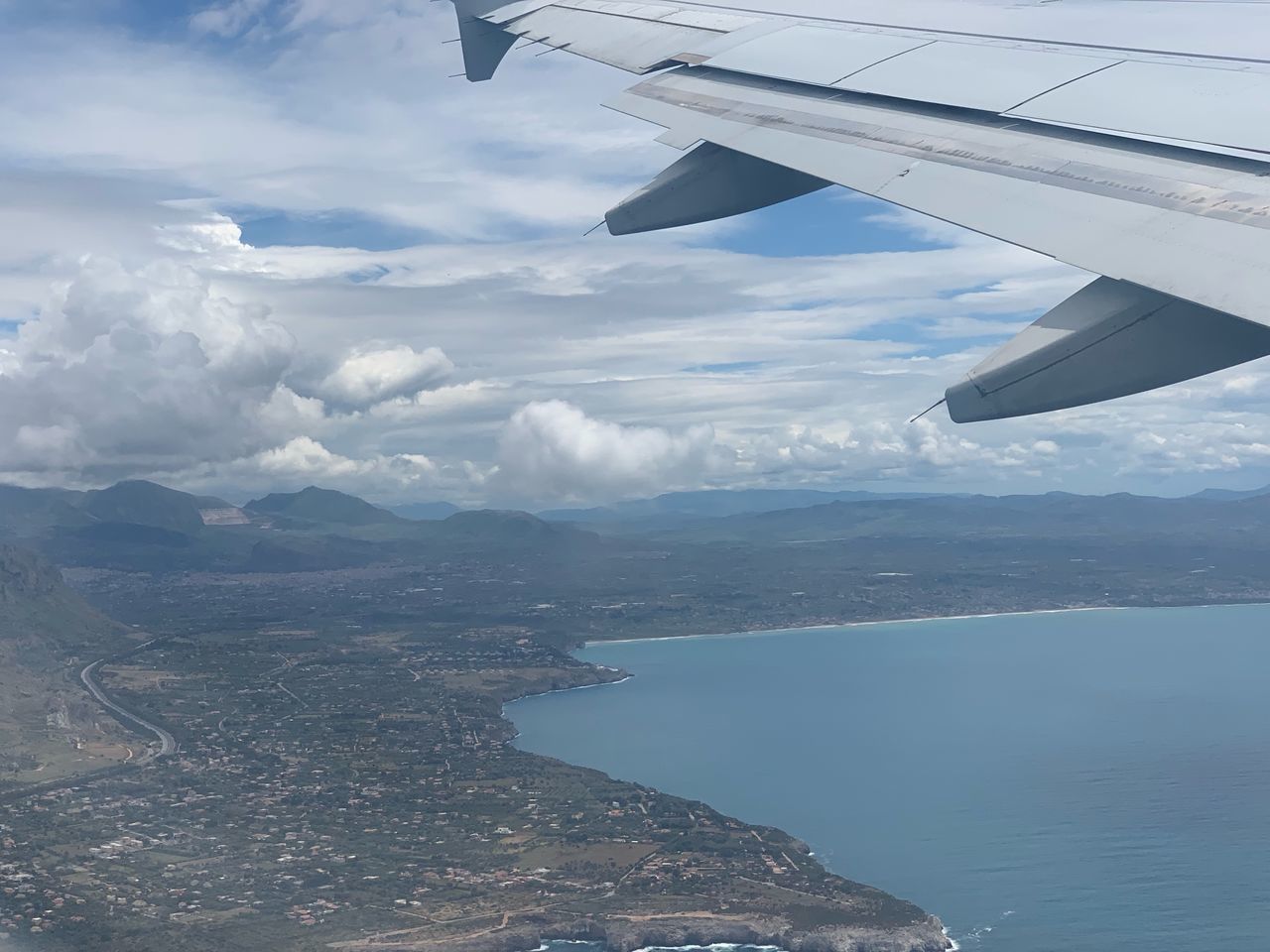 AERIAL VIEW OF SEA AND MOUNTAINS