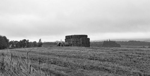 Old ruins on field against sky