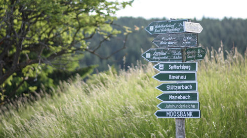 Close-up of information sign on field