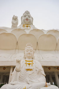 Low angle view of statue against building