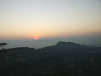 Scenic view of mountains against sky during sunset