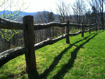 Wooden fence on field