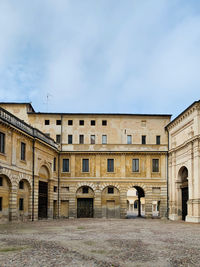 Facade of old building against sky