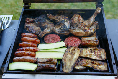 High angle view of food on barbecue grill