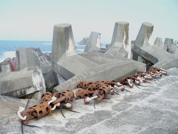 Panoramic shot of sea barriers against sky