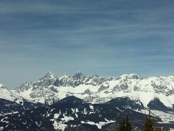 Scenic view of snow covered mountains against sky