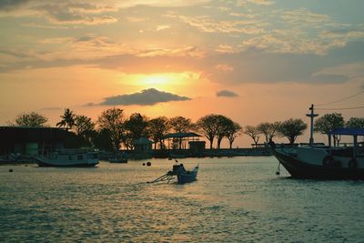 Scenic view of river against sky during sunset