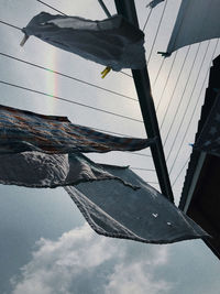 Low angle view of flags hanging from roof