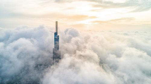 Low angle view of smoke stack against sky