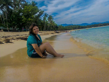 Full length of woman standing on beach