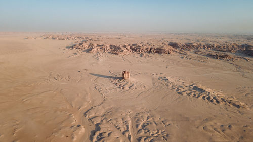 Aerial view of sand dune in desert against sky