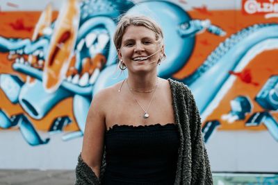 Portrait of smiling woman at amusement park