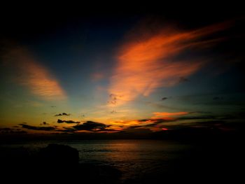 Scenic view of dramatic sky over sea during sunset