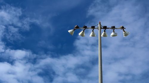 Low angle view of street light against sky