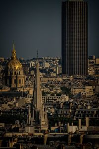 Hotel des invalides with cityscape against sky