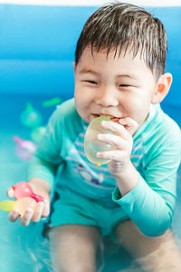 Portrait of cute baby boy with inflatable ring