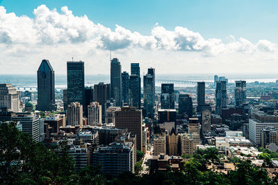 High angle view of buildings in city against sky