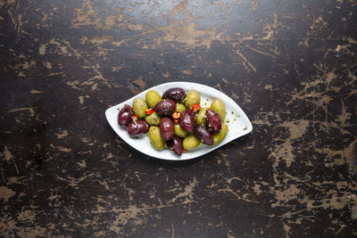 High angle view of fruits in plate on table