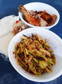 High angle view of meal served in bowls on table