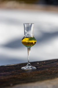 Close-up of wineglass on table