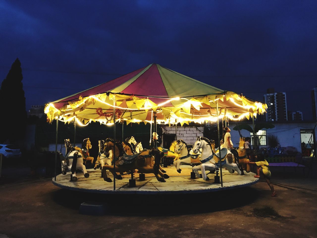 night, sky, illuminated, outdoors, arts culture and entertainment, leisure activity, beach, real people, men, carousel, sea, nature, water