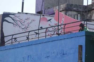 Low angle view of graffiti on building wall