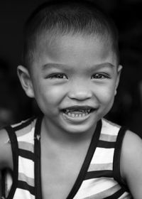 Portrait of cute smiling boy with gap teeth