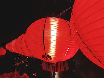 Low angle view of lantern hanging at night