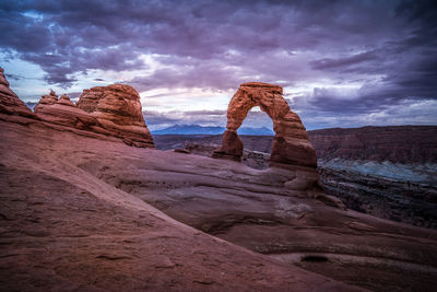 Rock formation on land against sky