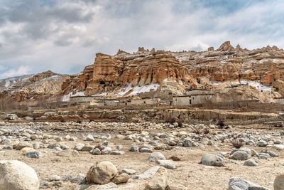 Panoramic view of rock formations on landscape against sky
