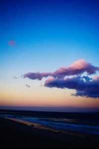 Scenic view of sea against sky at sunset