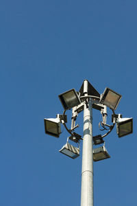 Low angle view of street light against clear blue sky