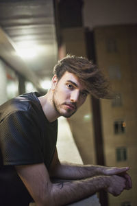 Portrait of young man sitting outdoors
