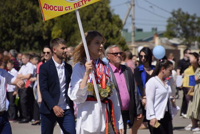 Group of people standing in street