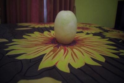 Close-up of apple on table at home