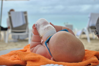 Close-up of baby drinking milk from bottle