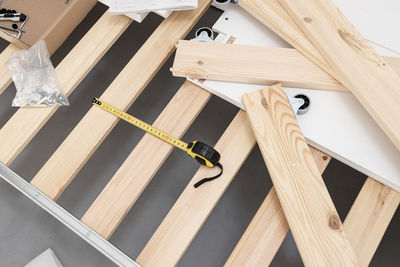 High angle view of piano on wooden floor