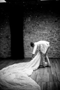 Full length of woman standing by railing