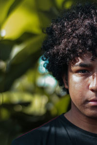 Close-up portrait of young man in park