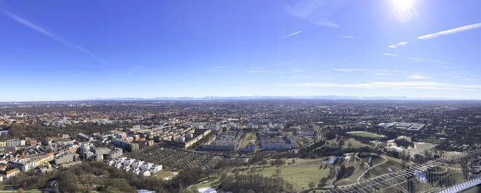 High angle view of city against blue sky