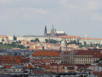 Buildings in town against sky
